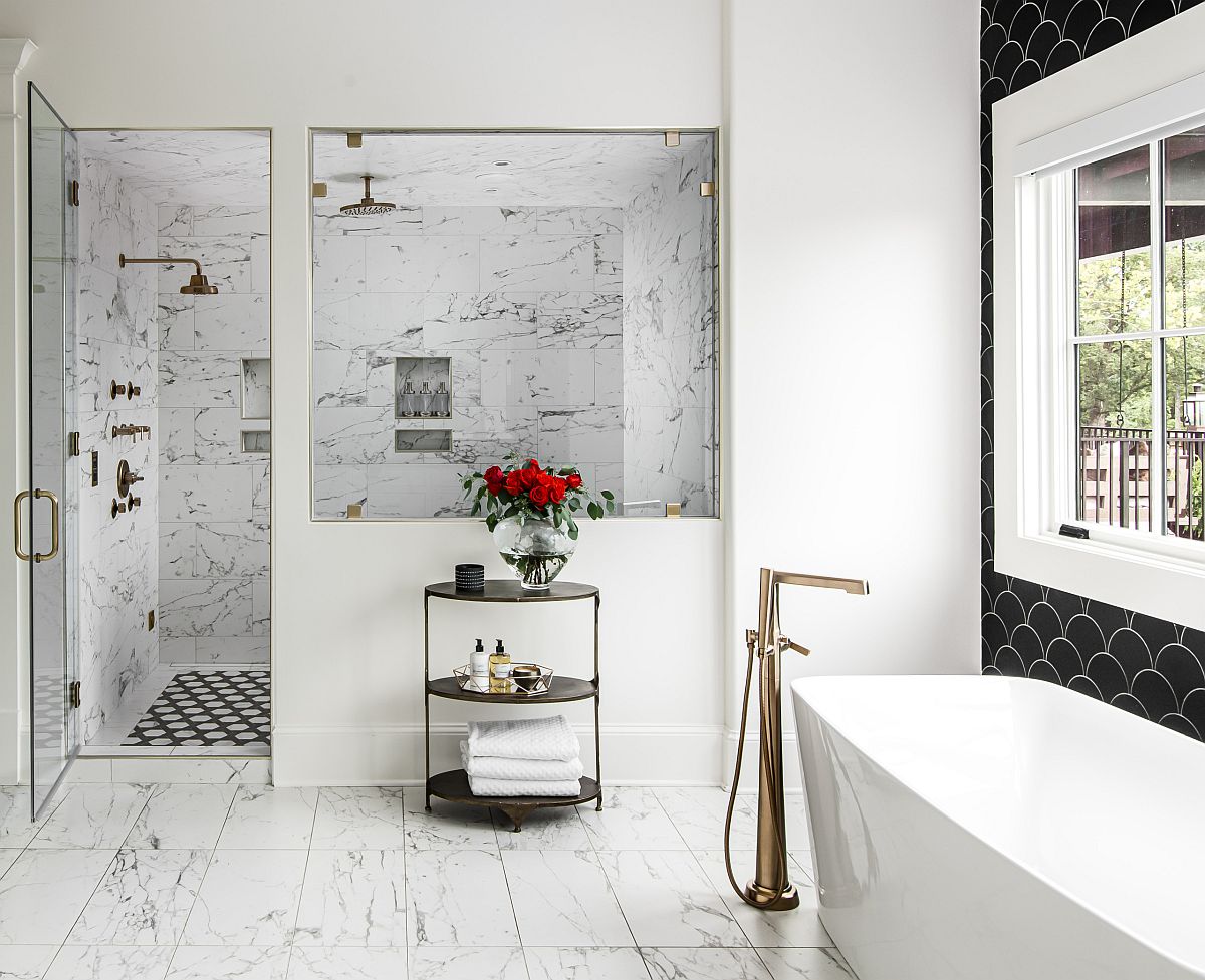Contemporary black and white bathroom with a freestanding bathtub in white and a trendy dark accent wall