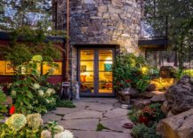 Curved-stone-wall-plays-into-the-overall-narrative-of-the-rustic-landscape-around-the-home-86696-217x155