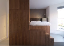 Custom-wooden-unit-inside-the-apartment-brings-different-functionalities-to-the-ultra-small-bedsit-56316-217x155