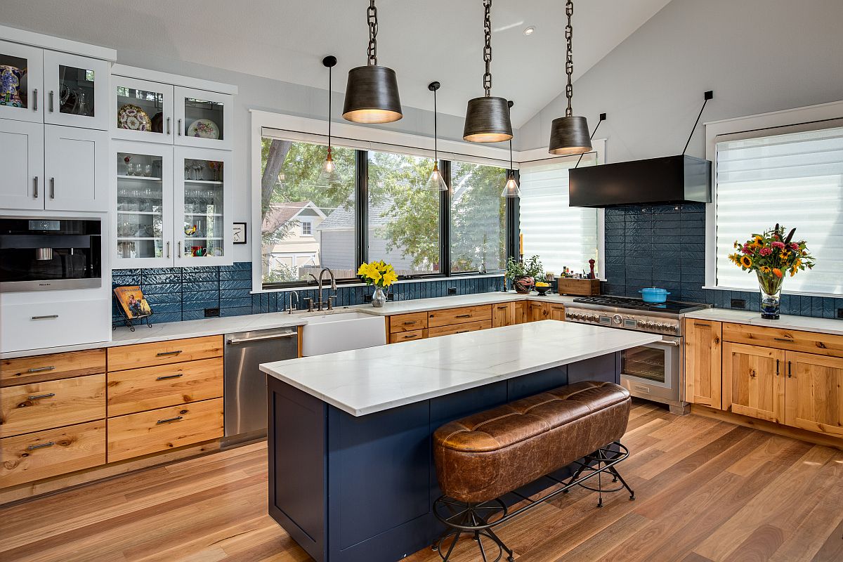 Dark-bluish-gray-is-a-popular-color-in-the-modern-farmhouse-kitchen-with-wooden-floors-and-cabinets-52485