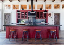 Dark-red-kitchen-island-along-with-cabinets-shapes-the-backdrop-of-this-farmhouse-industrial-kitchen-42183-217x155
