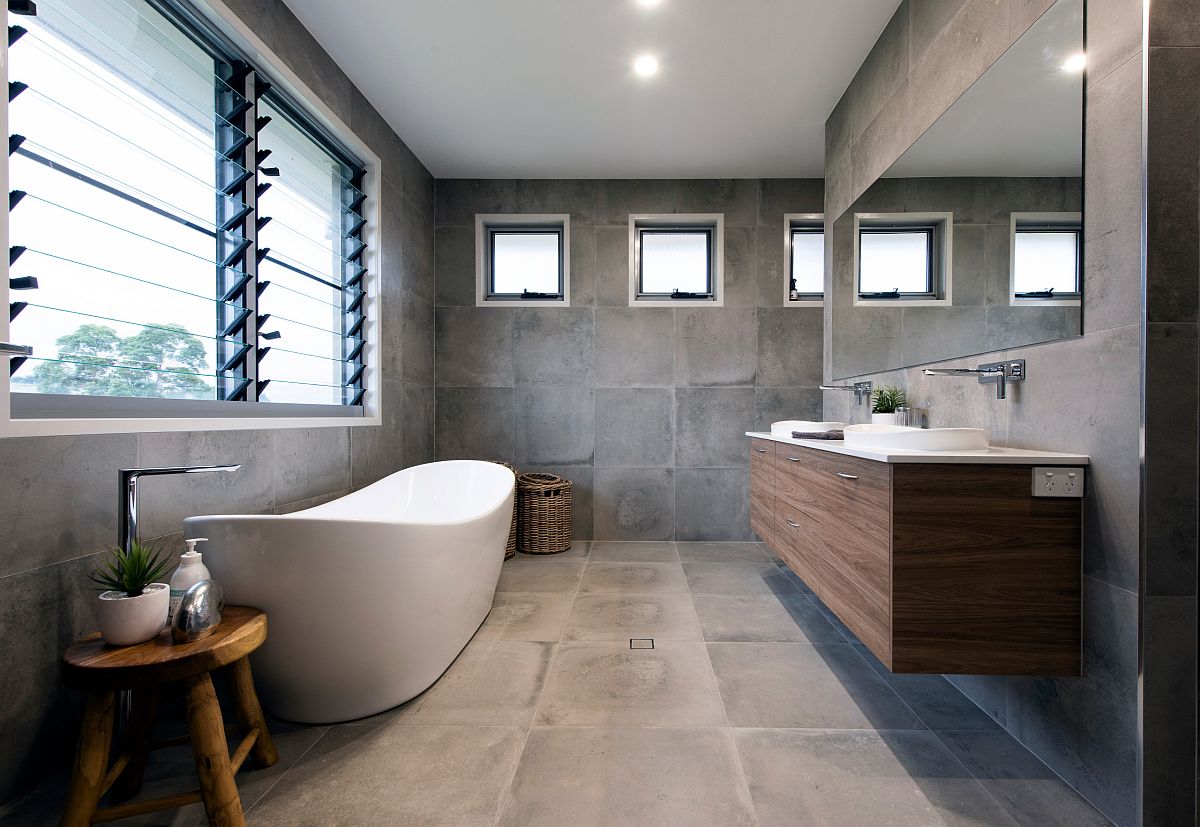 Dashing contemporary bathroom in gray with a white freestanding bathtub