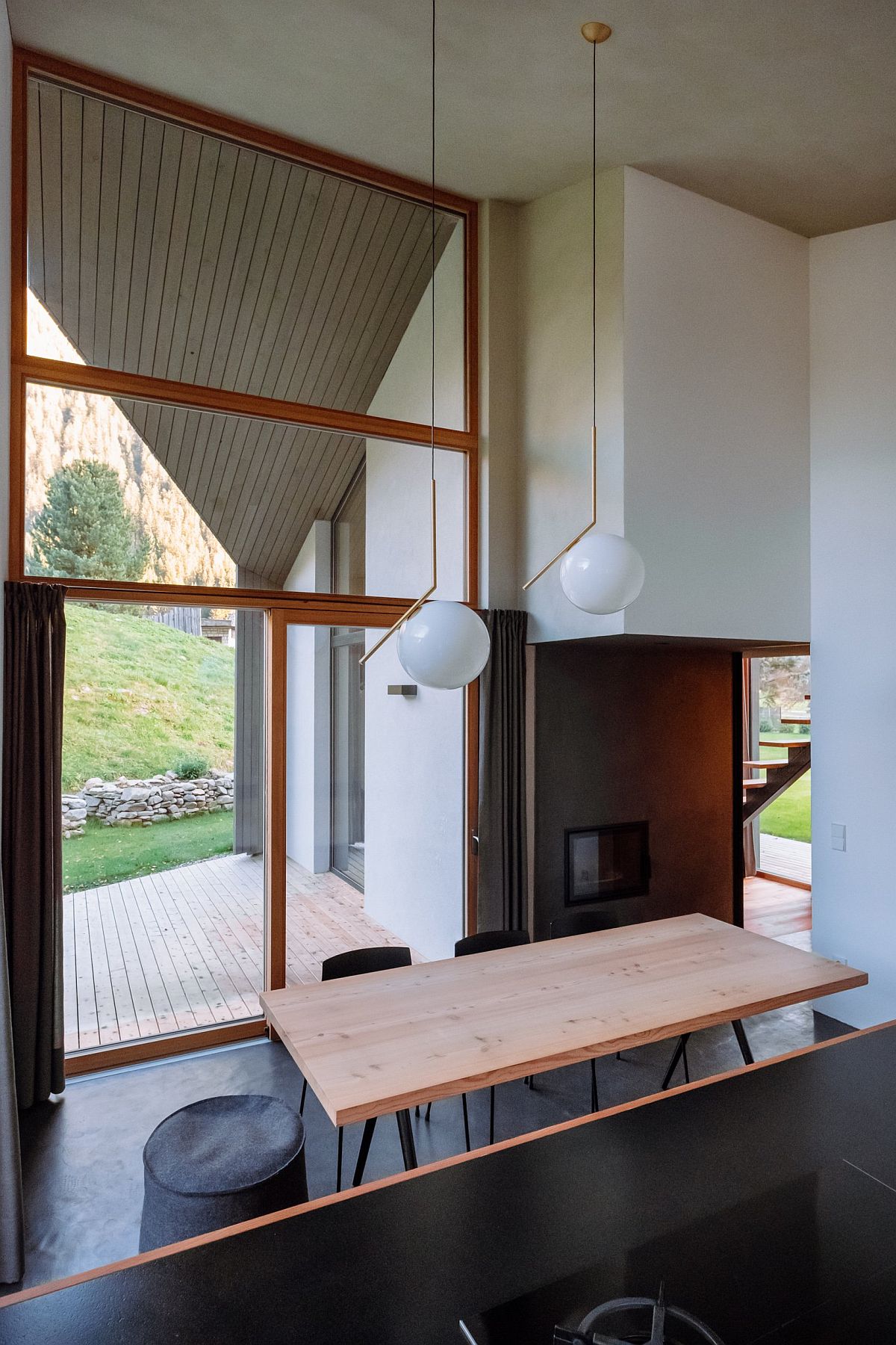 Double-height ceiling gives the interior of this home a spacious and elegant visual appeal