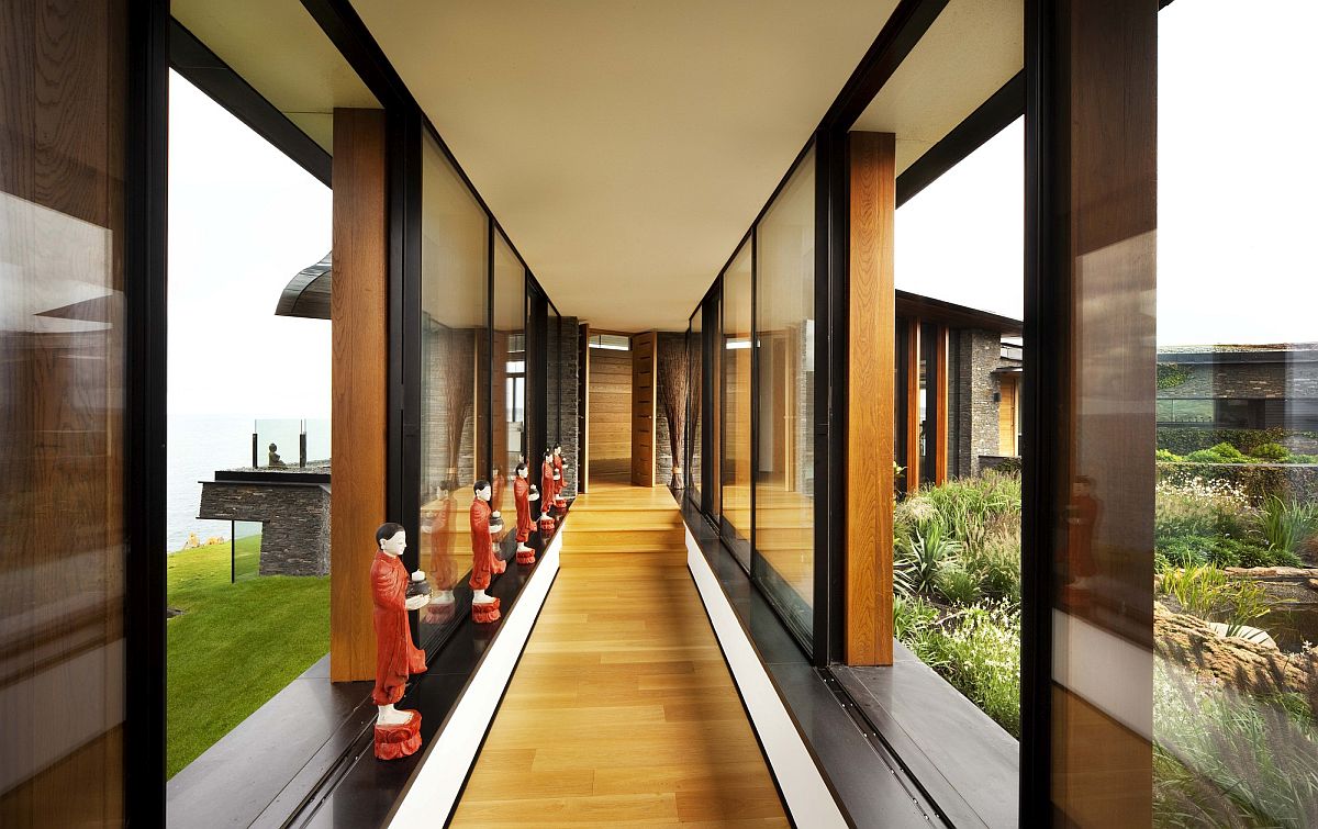 Fabulous closed walkway with glass walls connects different parts of the home