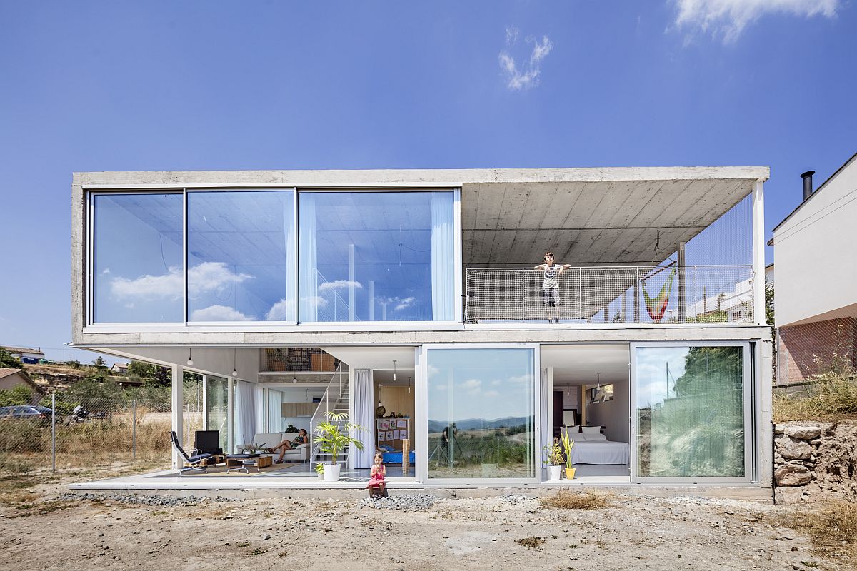 Garage and studio sit on the upper level of the house while the living areas occupy the lower floor