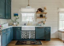 Gorgeous-grayish-blue-cabinets-along-with-brass-handles-bring-bightness-to-this-farmhouse-style-kitchen-30024-217x155