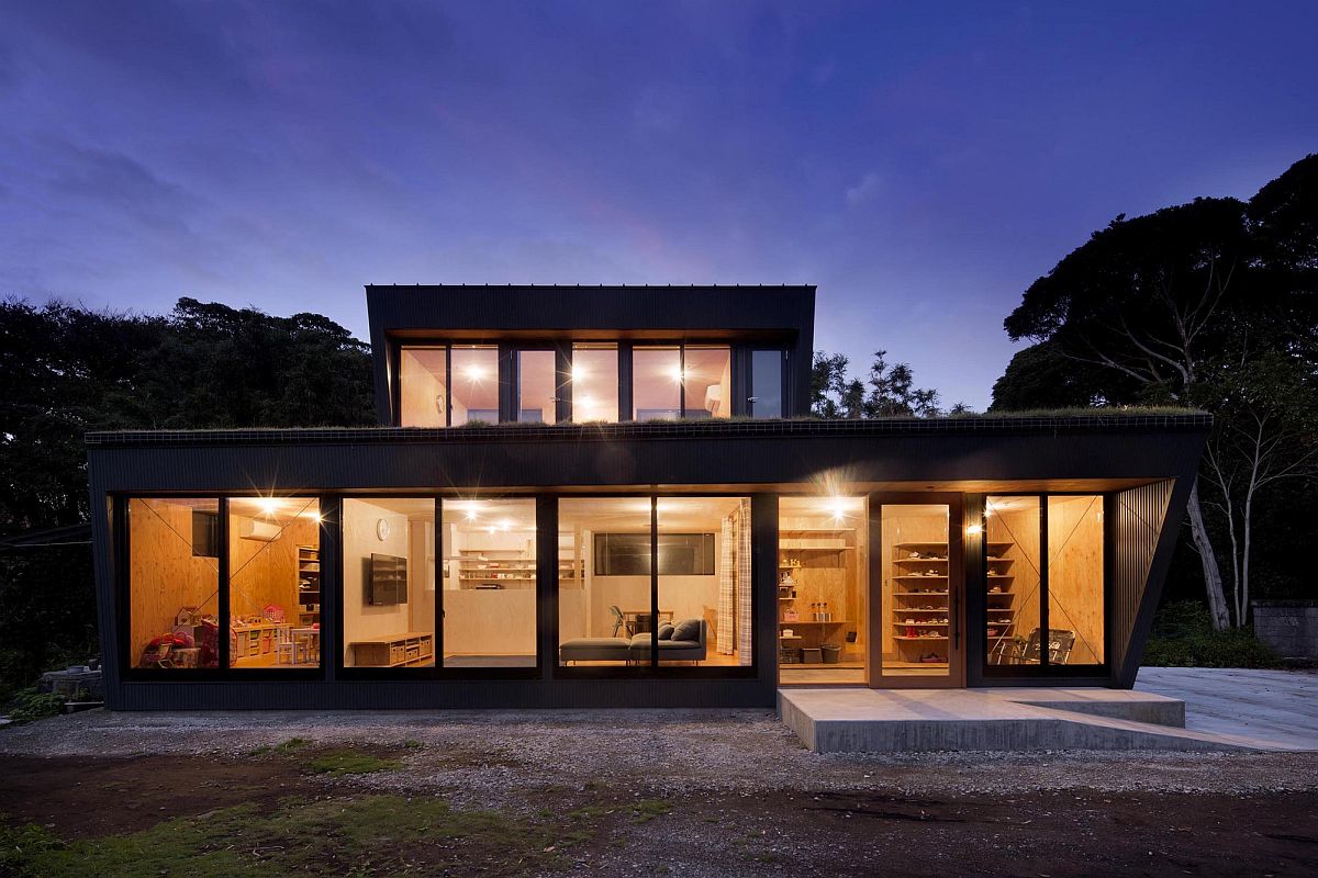 Gorgeous use of sliding glass doors connect the entire home with the landscape outside it