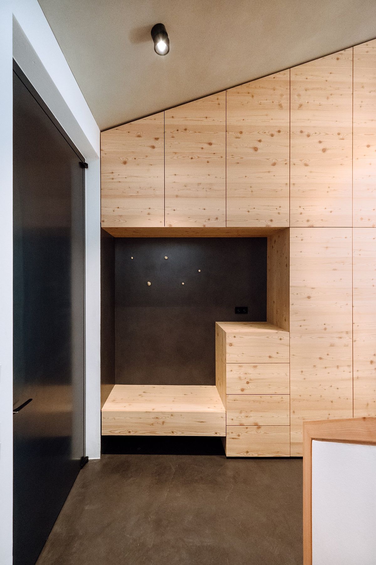 Larch and pine wood cabinets create a perfect backdrop in the kitchen and offer ample storage space