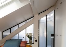 Light-filled-small-bedroom-of-French-apartment-with-white-walls-skylights-gray-floor-and-colorful-bedding-86475-217x155