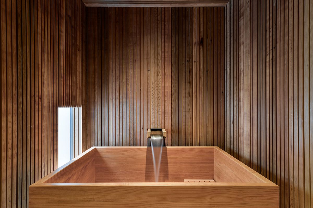 Modern Japanese soaking tub in wood is perfect for the small bathroom