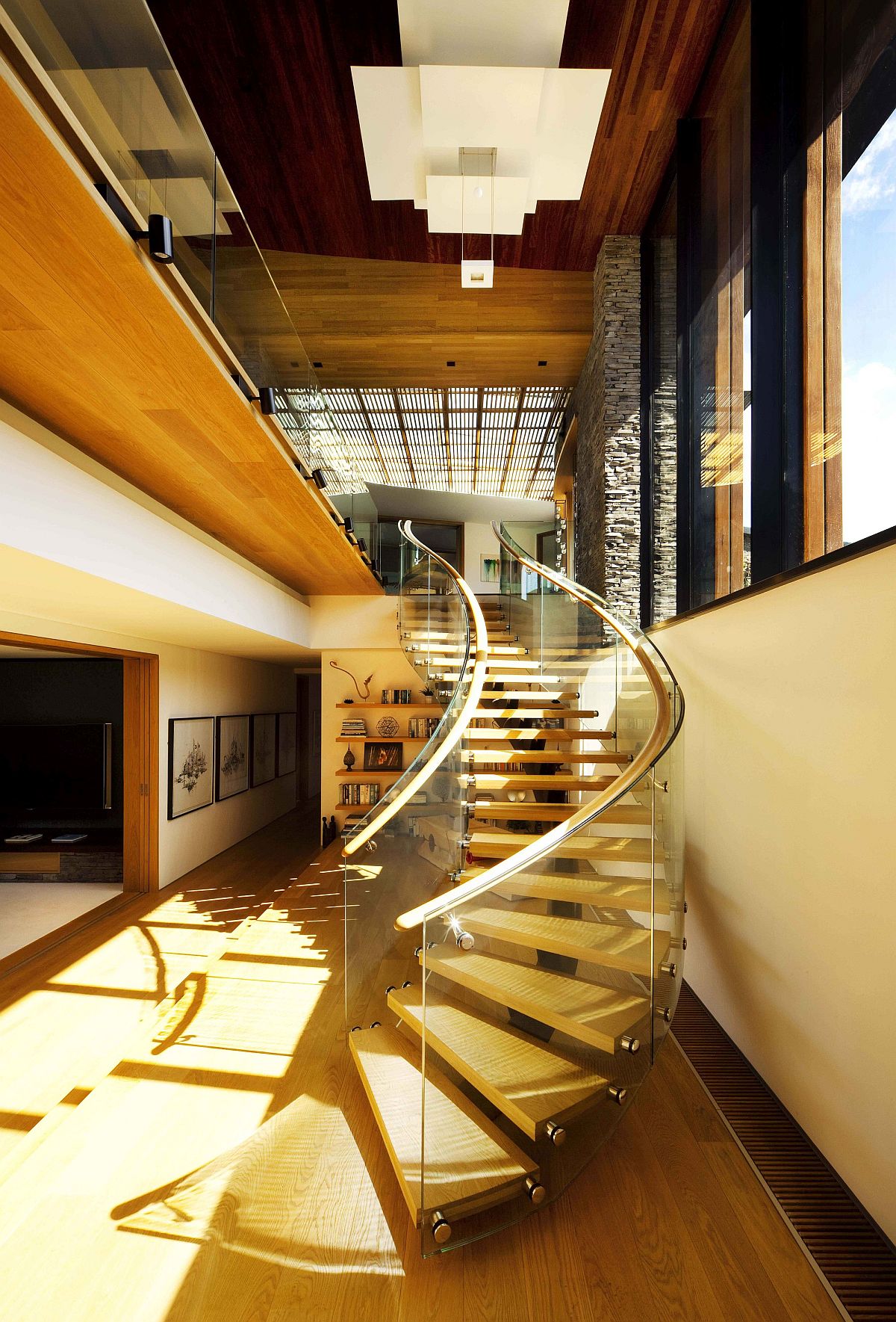 Modern curvy staircase leads way to the upper level of the home