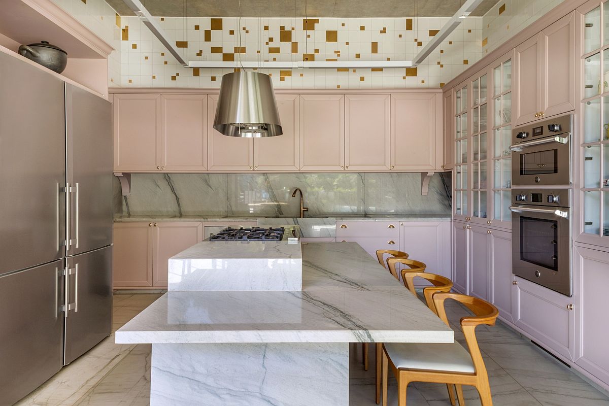 Pastel pink cabinets and light green add color to the modern kitchen