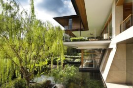 Roof Gardens and Sloping Terraces Shape Extensive Family Home in Singapore