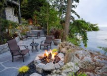 Rustic-waterside-terrace-and-backyard-with-fireplace-and-ample-sitting-space-35383-217x155