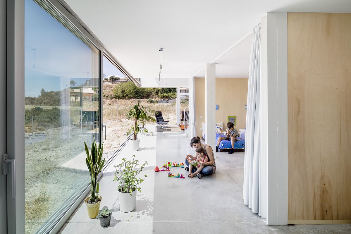 Sliding glass doors connect the lower level living areas and bedroom with the outdoors