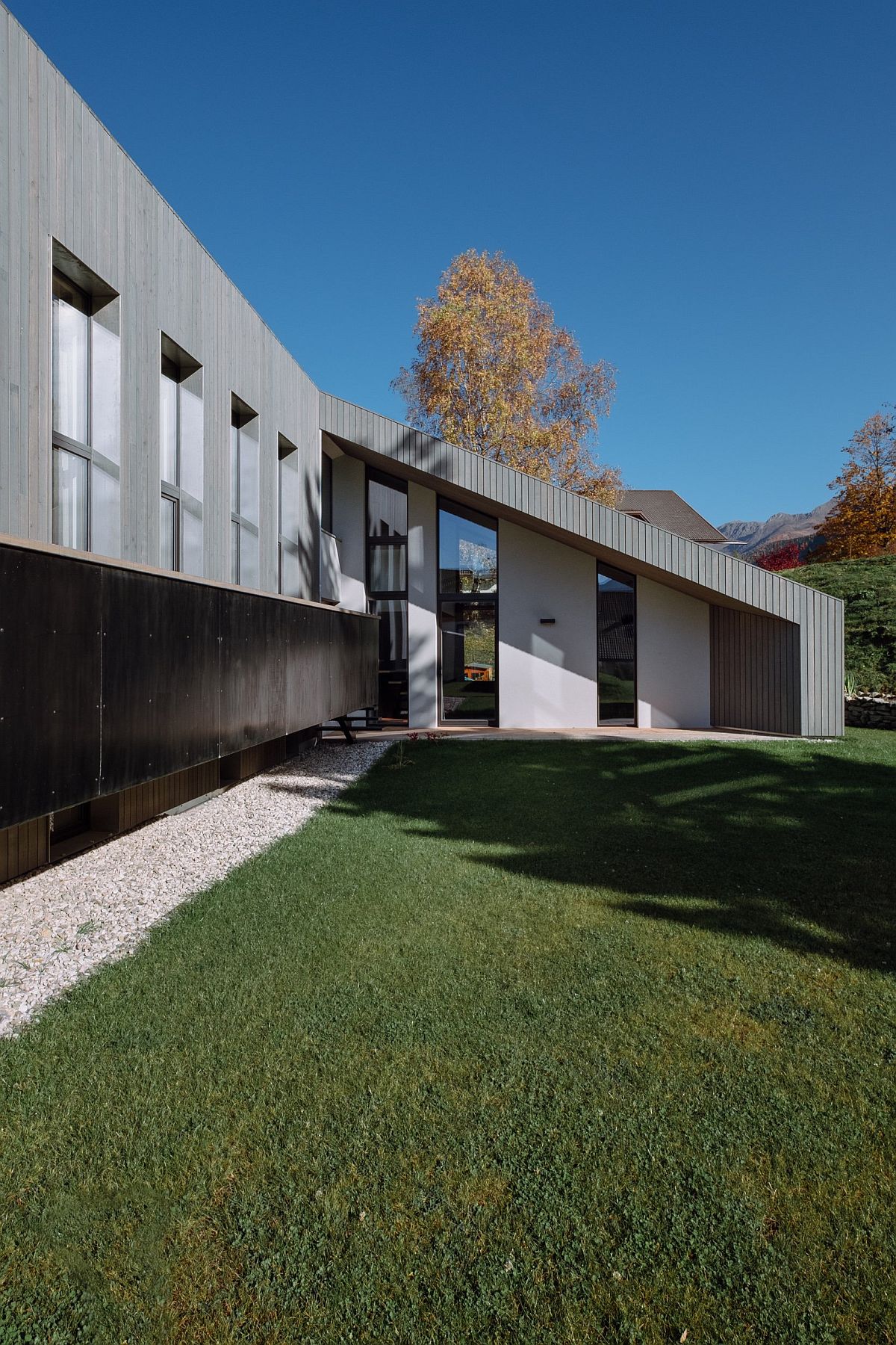 Sloped roofs and custom exterior give the home an identity of its own