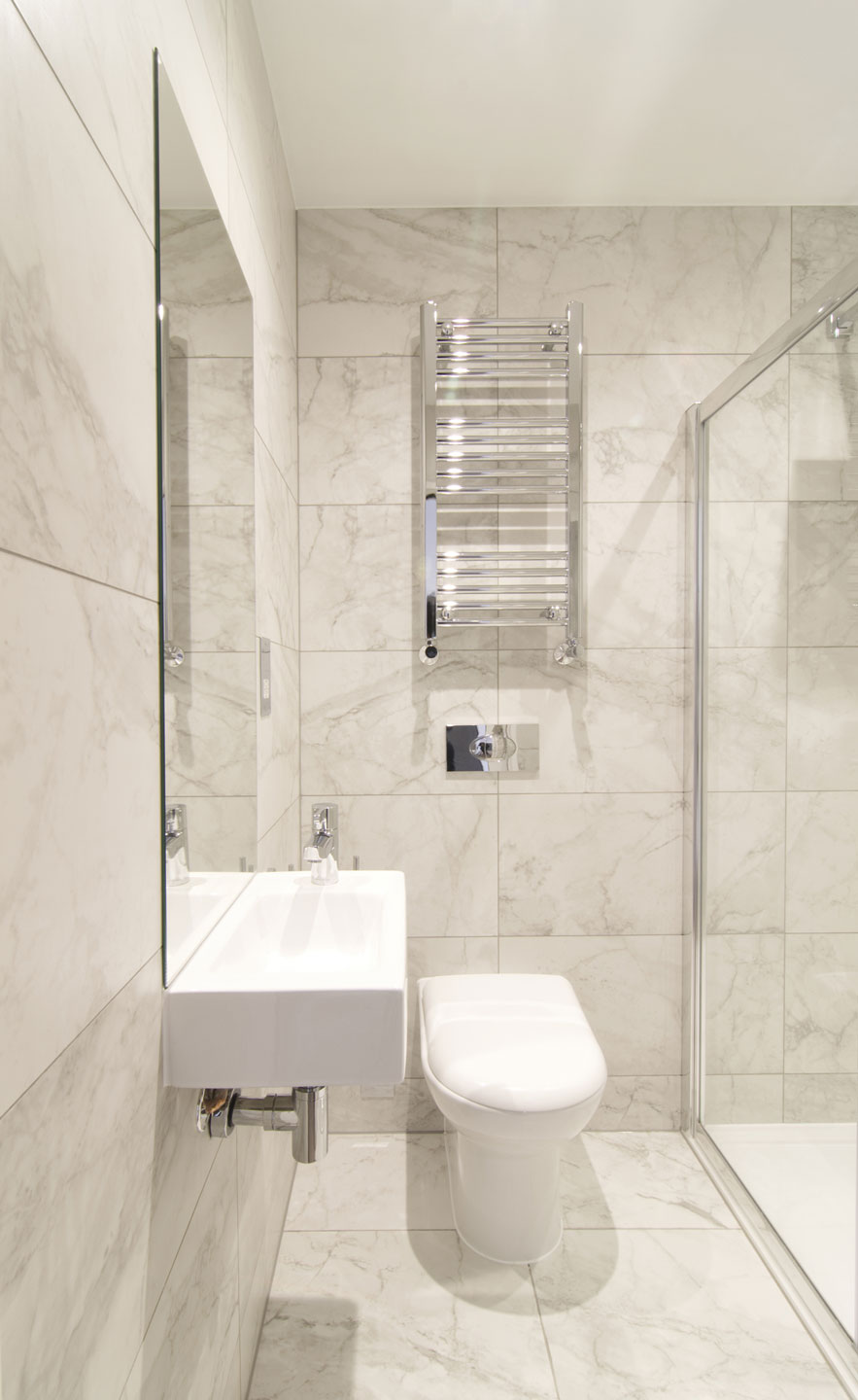 Small contemporary bathroom in white with glass shower area
