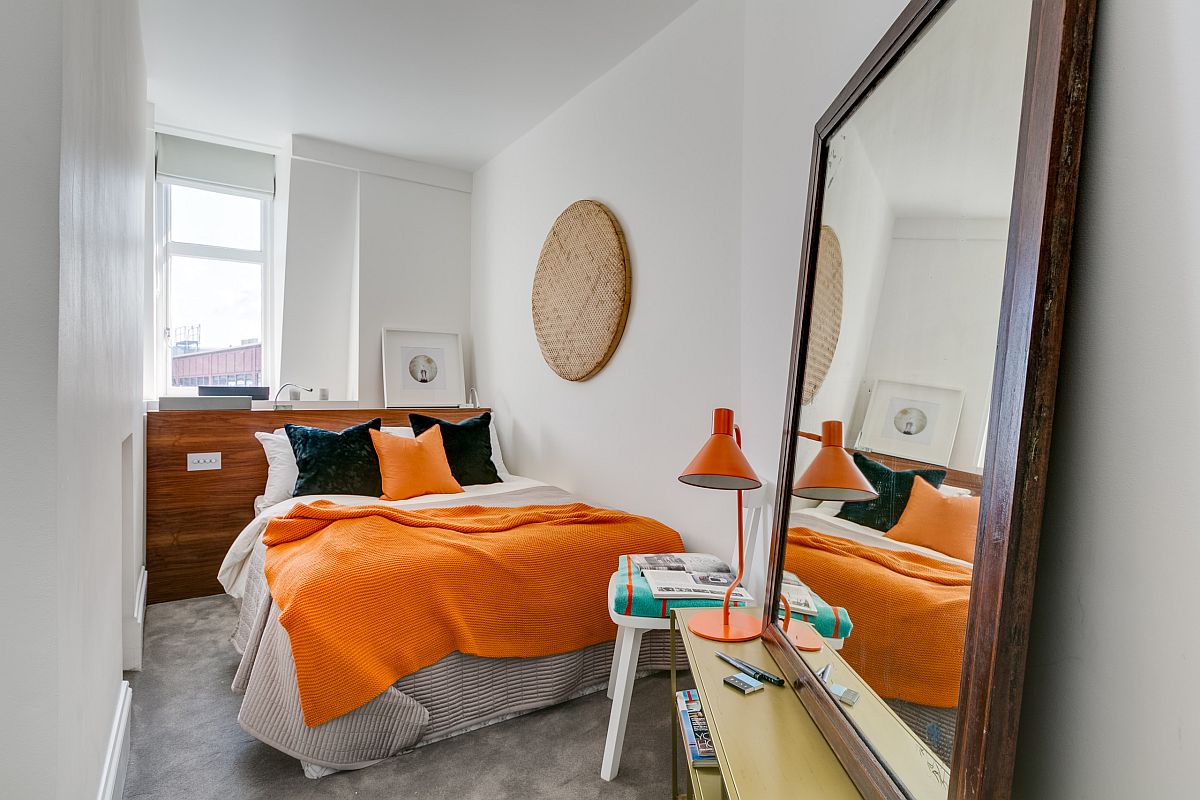 Small-modern-London-bedroom-in-white-with-large-mirror-on-the-floor-and-yellow-accents-43986