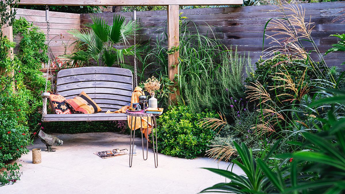 Smart modern rustic landscape with a swing seat and ample greenery