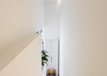 Staircasein-white-leading-to-the-upper-level-of-the-store-with-smart-lighting-73142-217x155