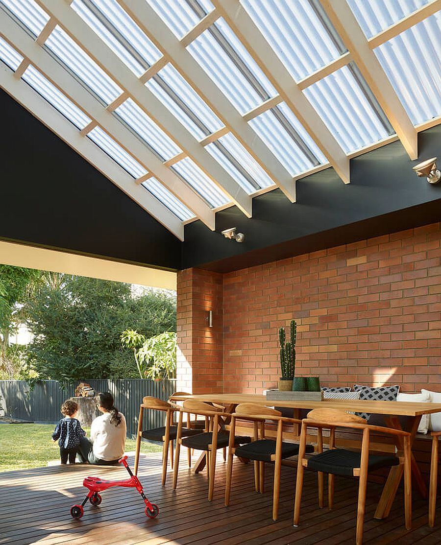 Wood and brick extension of the classic home contains the new kitchen, dining area and living room