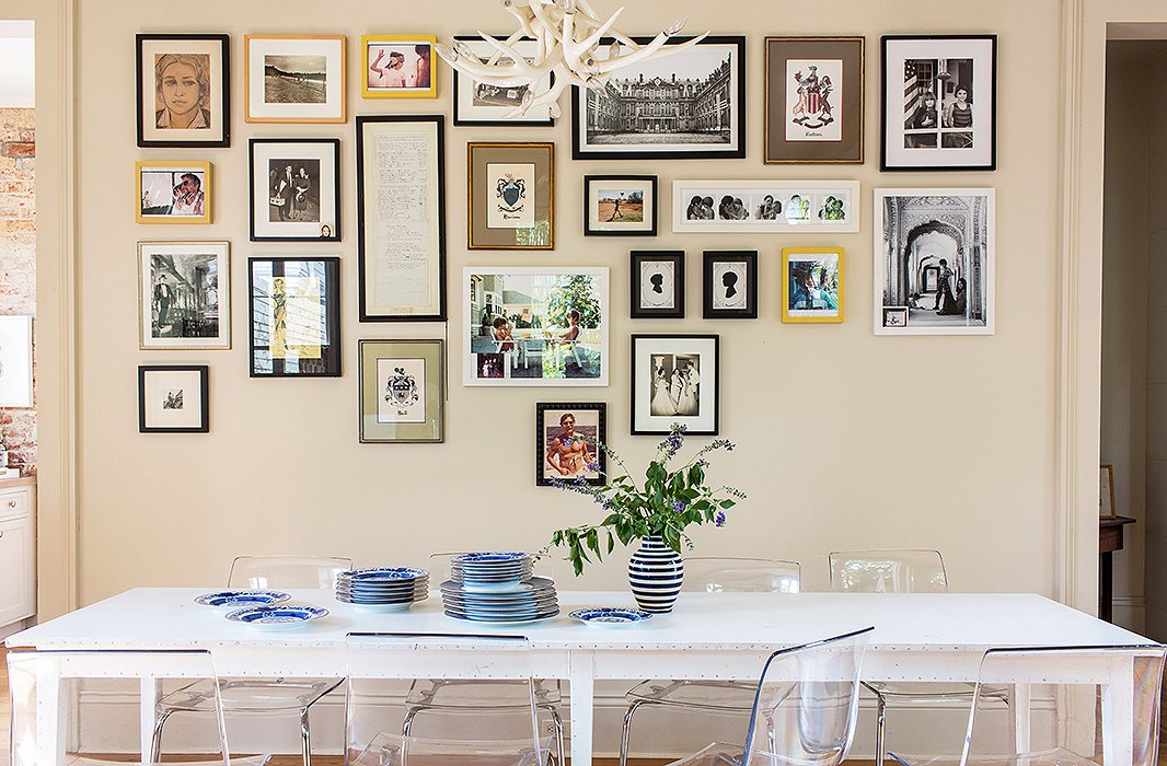 a gallery wall with photos lined at the top