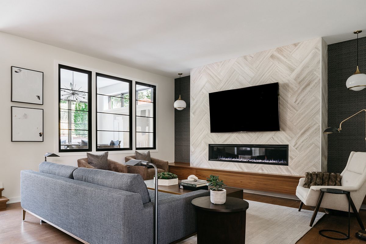 Contemporary family room of Chicago home where the television is placed above the fireplace