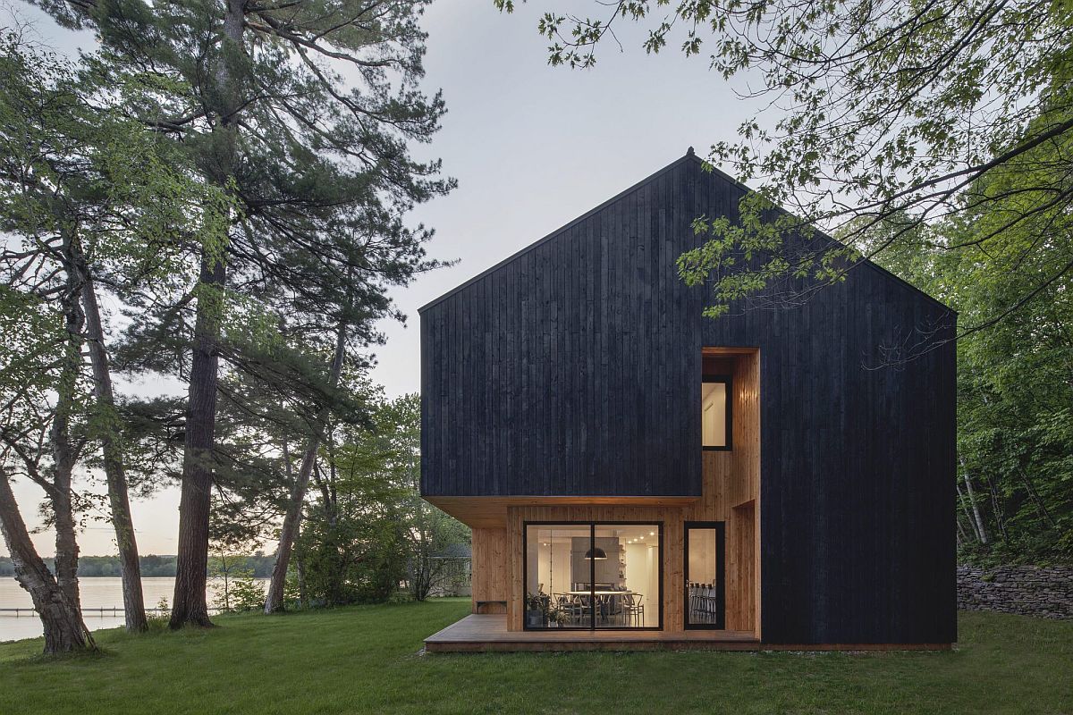 Dark treated larch exterior of the Lakeside Cabin in Canada with lovely lake views