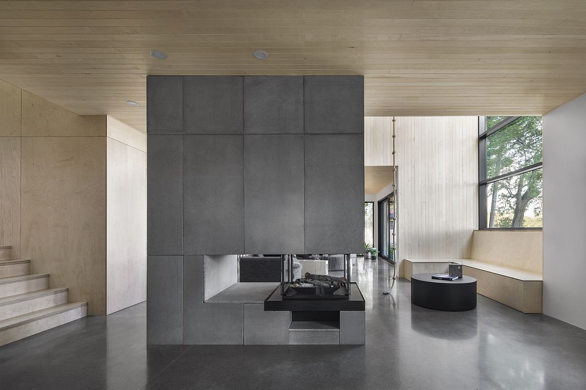 Double-sided-concrete-fireplace-sits-at-the-heart-of-the-new-living-area-61694