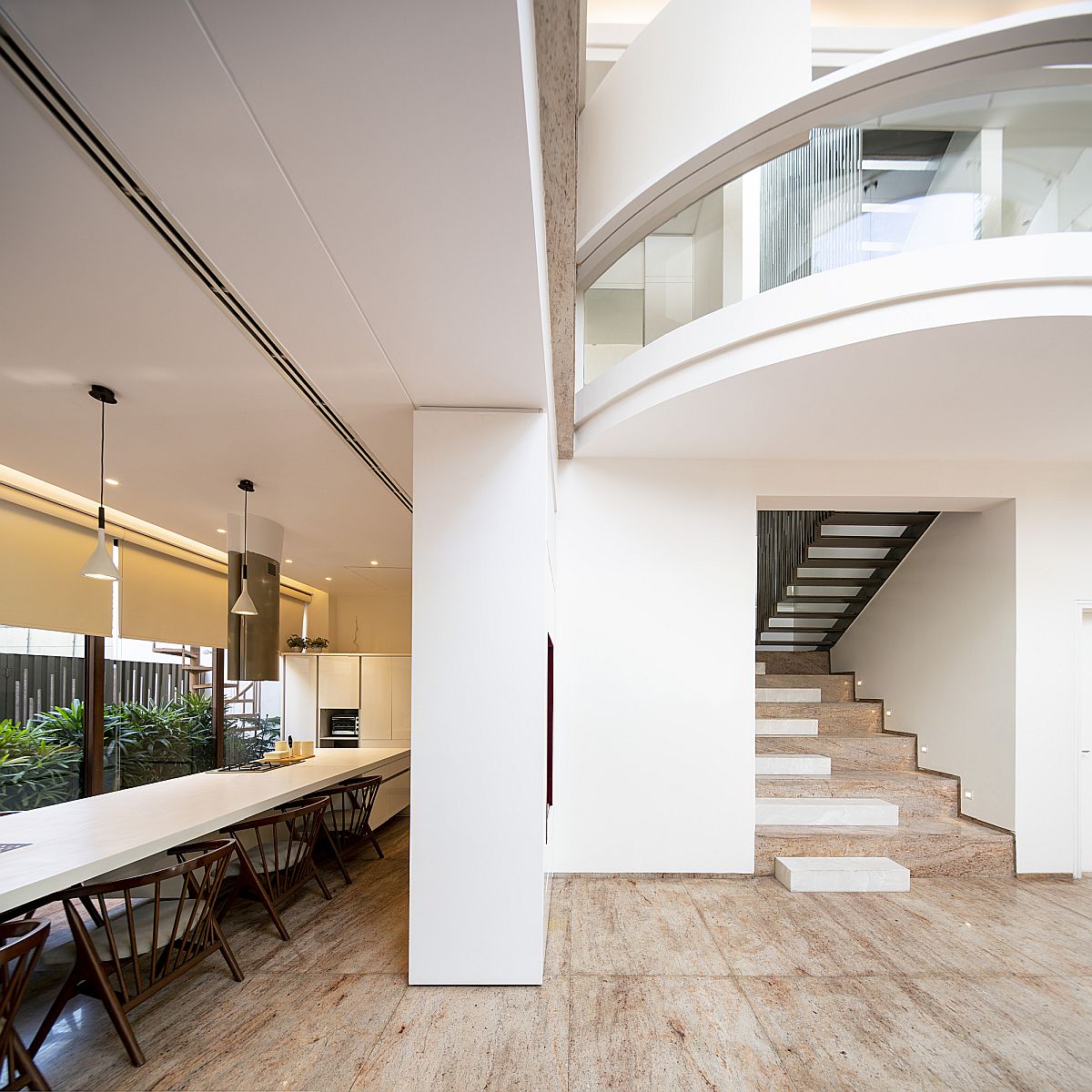 Expansive dining area o the house next to the kitchen with a splash of green outside