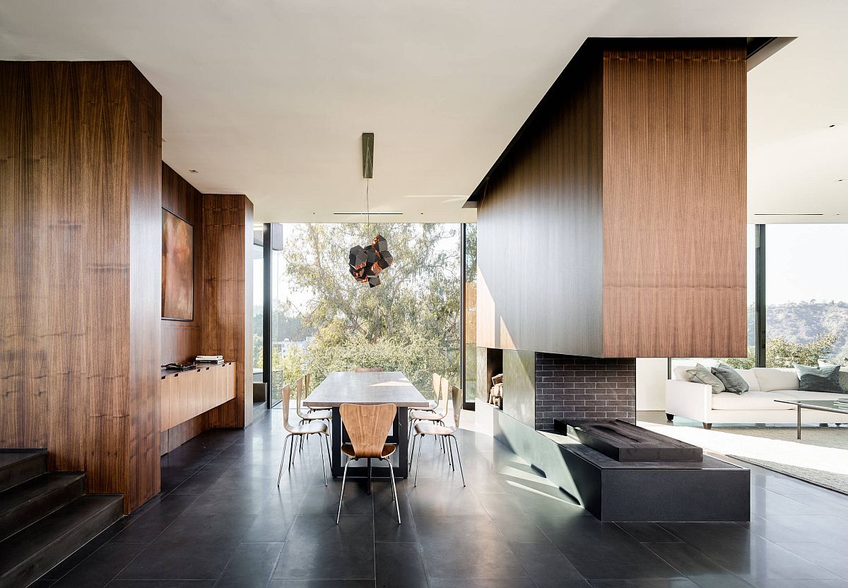 Fireplace brings oak elegance and beauty to this dashing, dark dining room