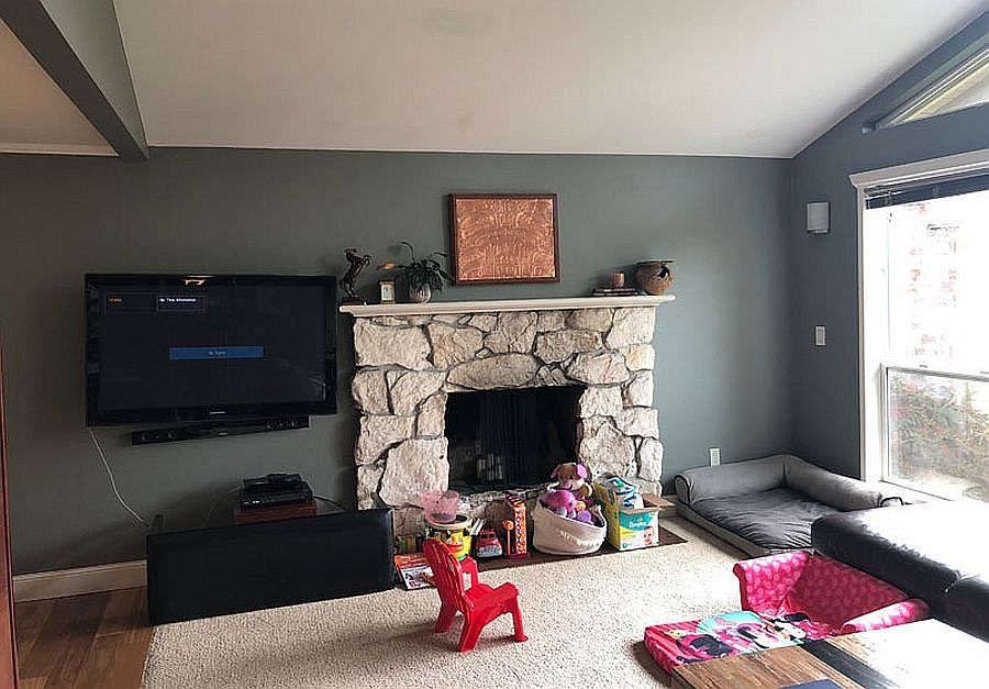 Images of the living room and the old fireplace of the house before renovation