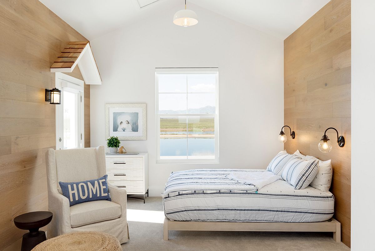 Modern, light-filled beach style kids' bedroom in wood and white with ample natural light