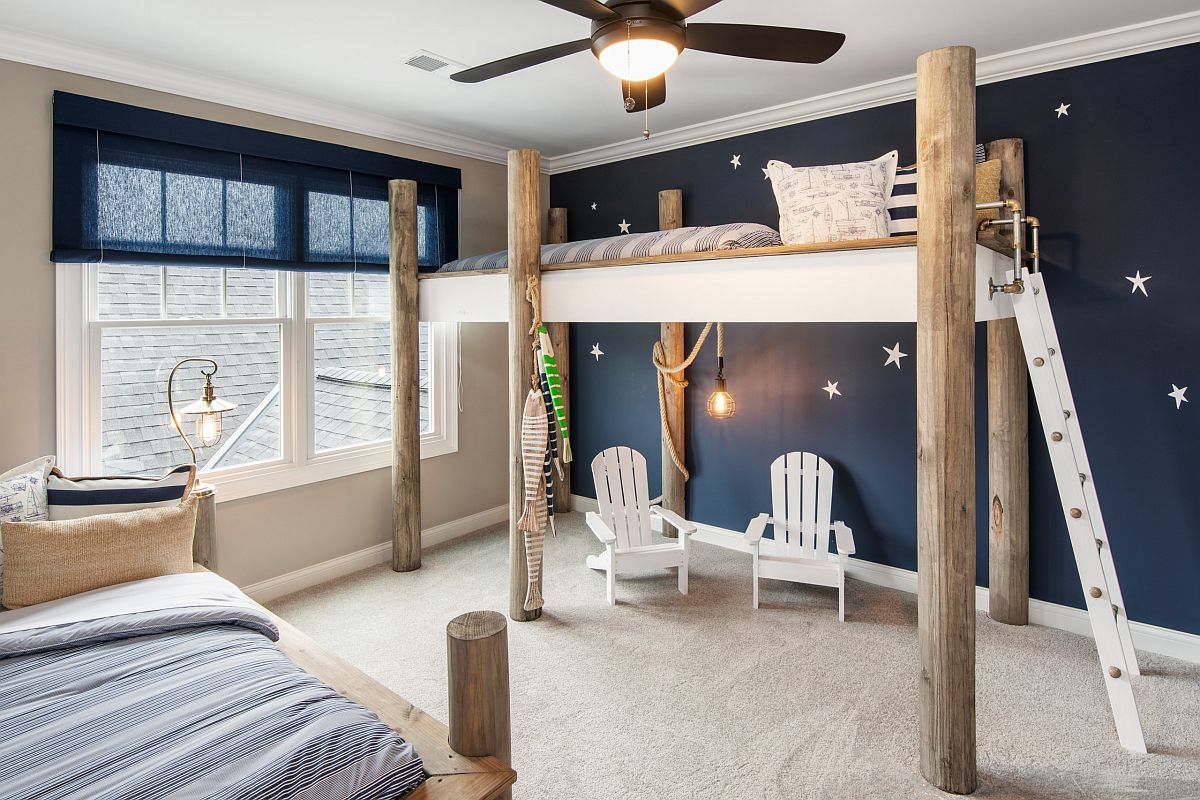 Picture-perfect and contemporary beach style kids' bedroom in deep blue with a bunk bed