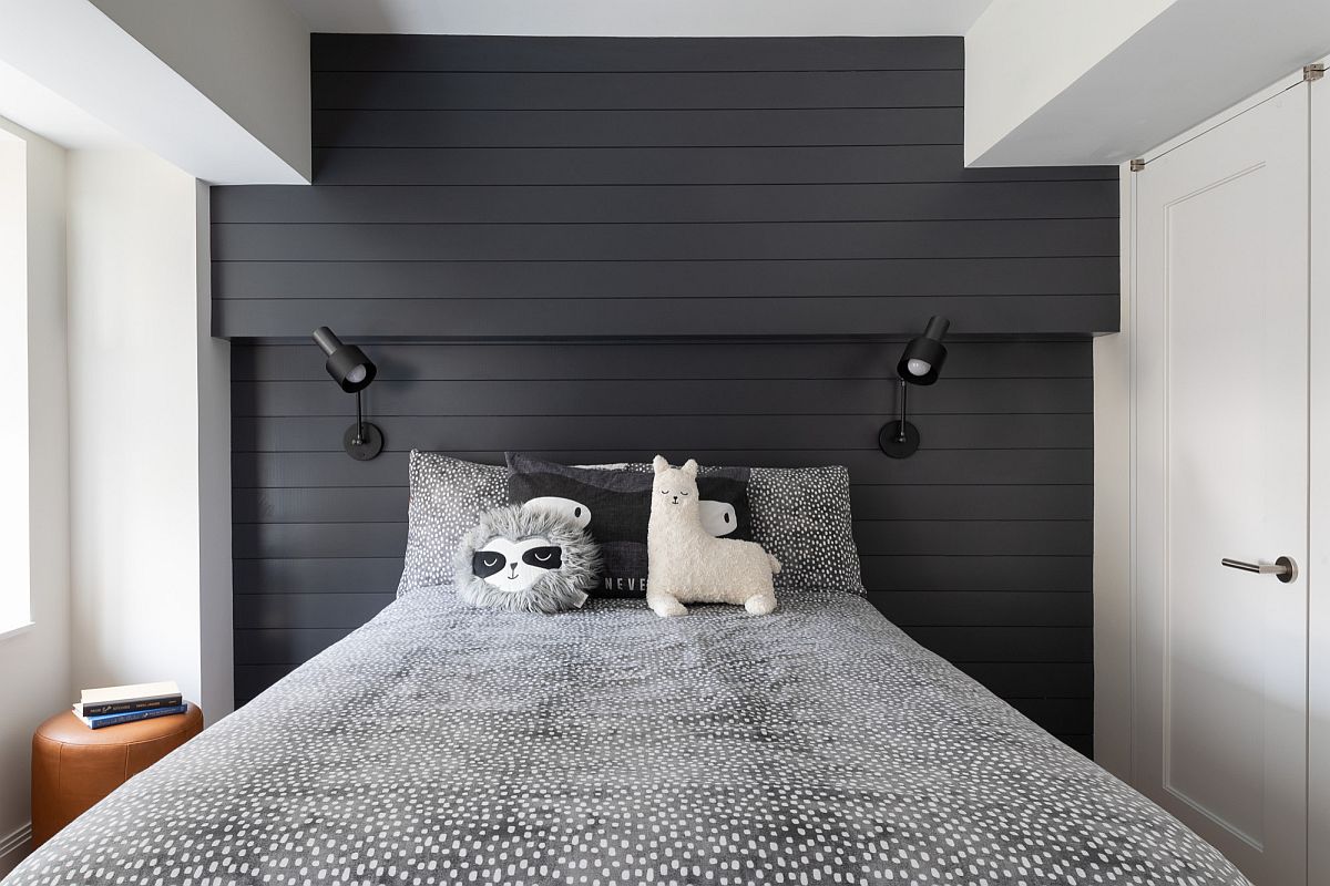 Polished bedroom in white and gray with small bedside stool and smart lighting