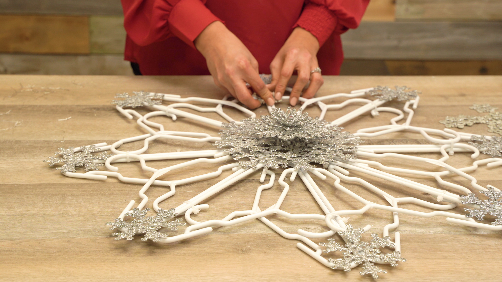 decorating snowflake formation with tinsel snowflake