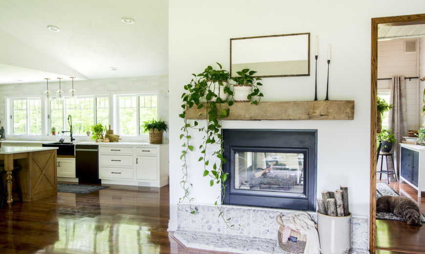 floating wooden beam mantel against white wall