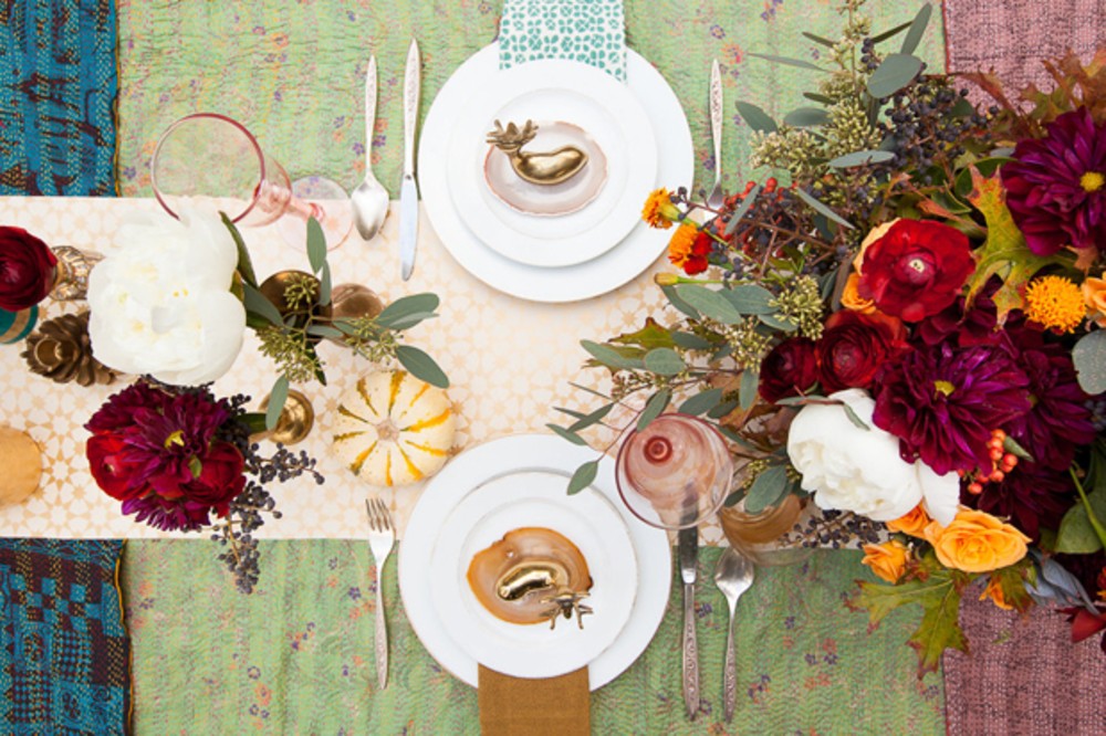 a thanksgiving table decorated with bright patterns
