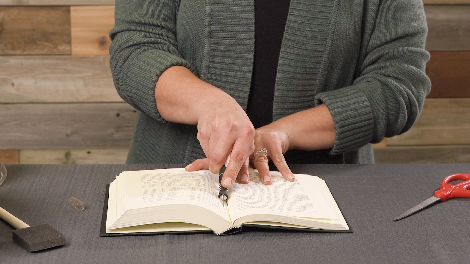 cutting book pages with knife