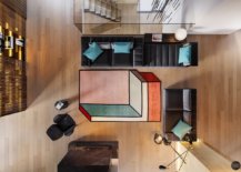 overhead shot of large geometric rug at center of living room