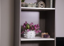 modern marble vase with flowers on shelf