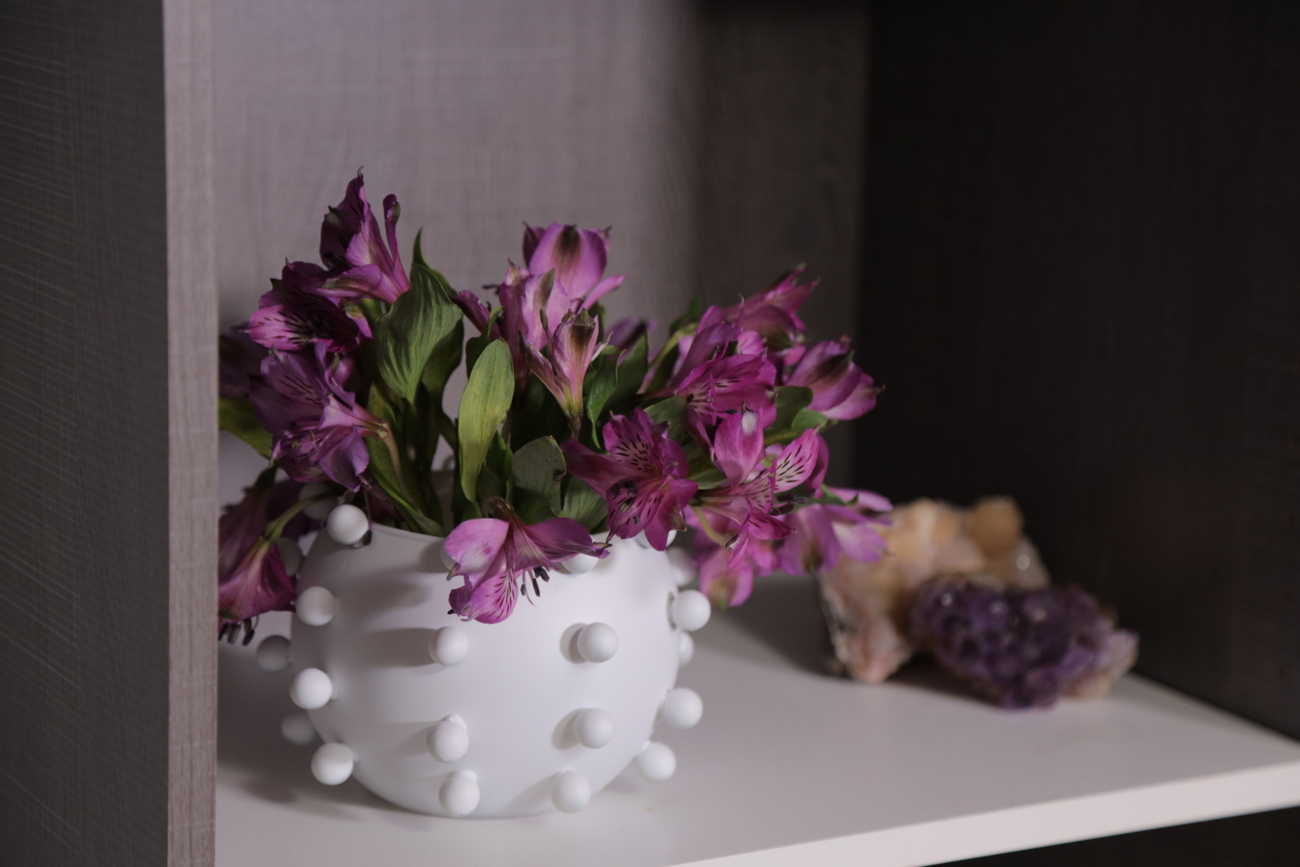 close up finished marble vase with flowers