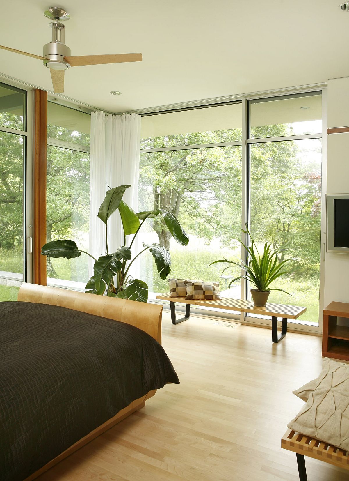 Allow the world outside to bring color into the bedroom along with freshness