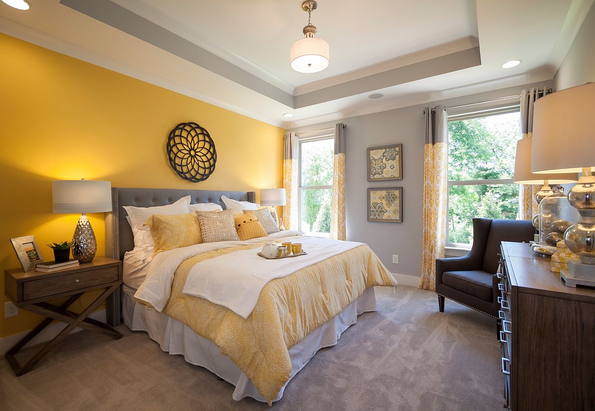 Balanced use of yellow and gray in the spacious modern bedroom