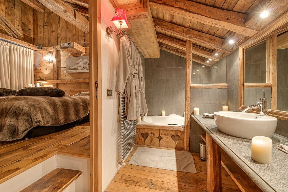 Bathroom and bedroom at the Chalet Le Rocher in Val d&#039;Isere