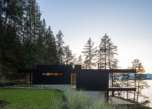 Black-stained-cedar-allows-the-lovely-retreat-to-blend-into-the-forest-scape-after-sunset-with-ease-59153-217x155