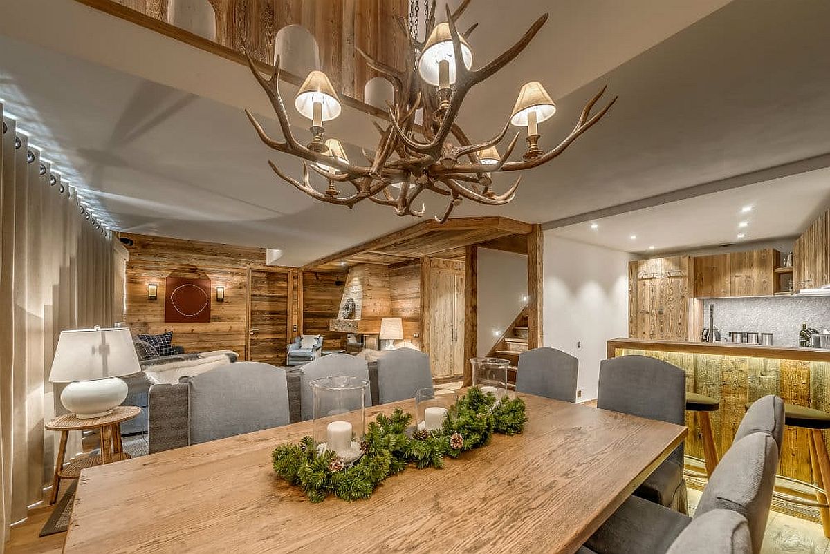 Chandelier above the dining table with unique design that makes it perfect for the alpine escape