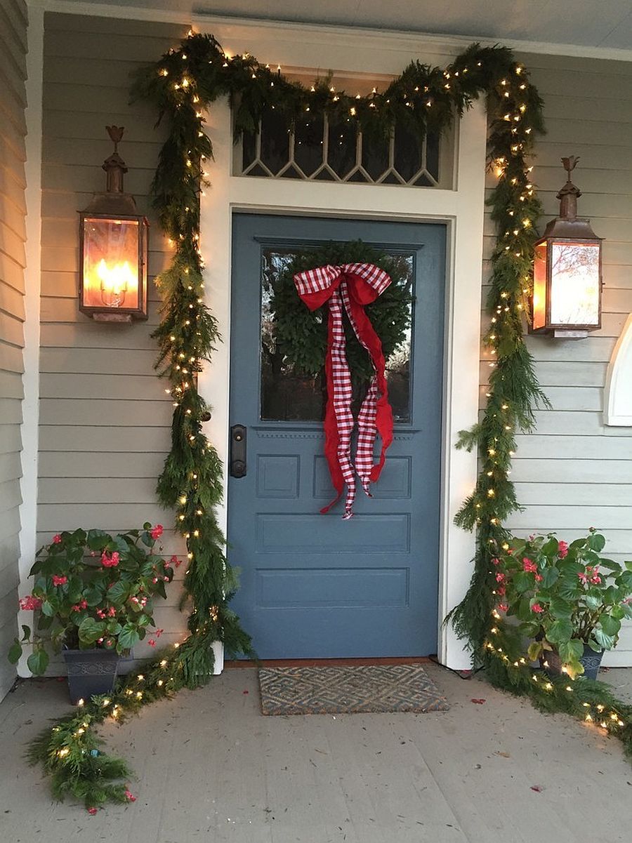 Combine-the-lush-green-garland-with-string-lighting-for-a-smart-entryway-that-feels-cheerful-75092