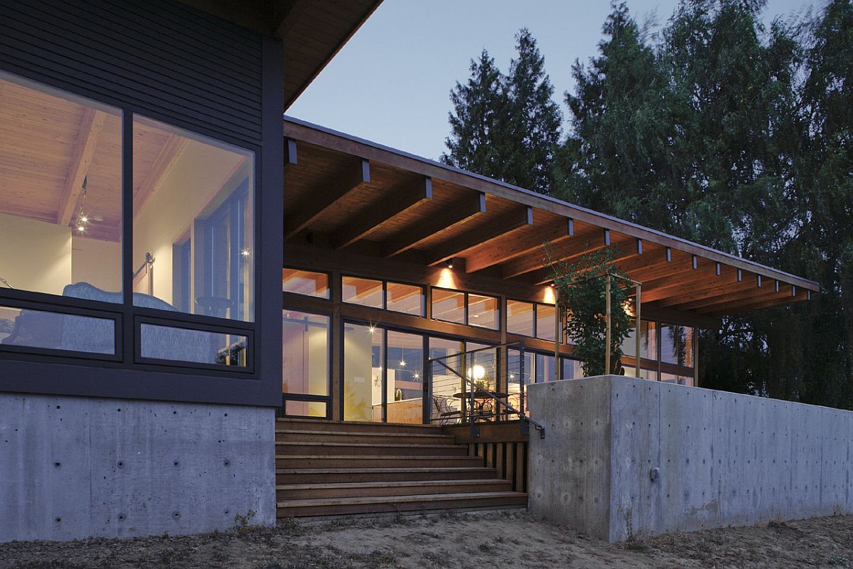 Concrete base of the budget home in Vancouver with wood and glass walls