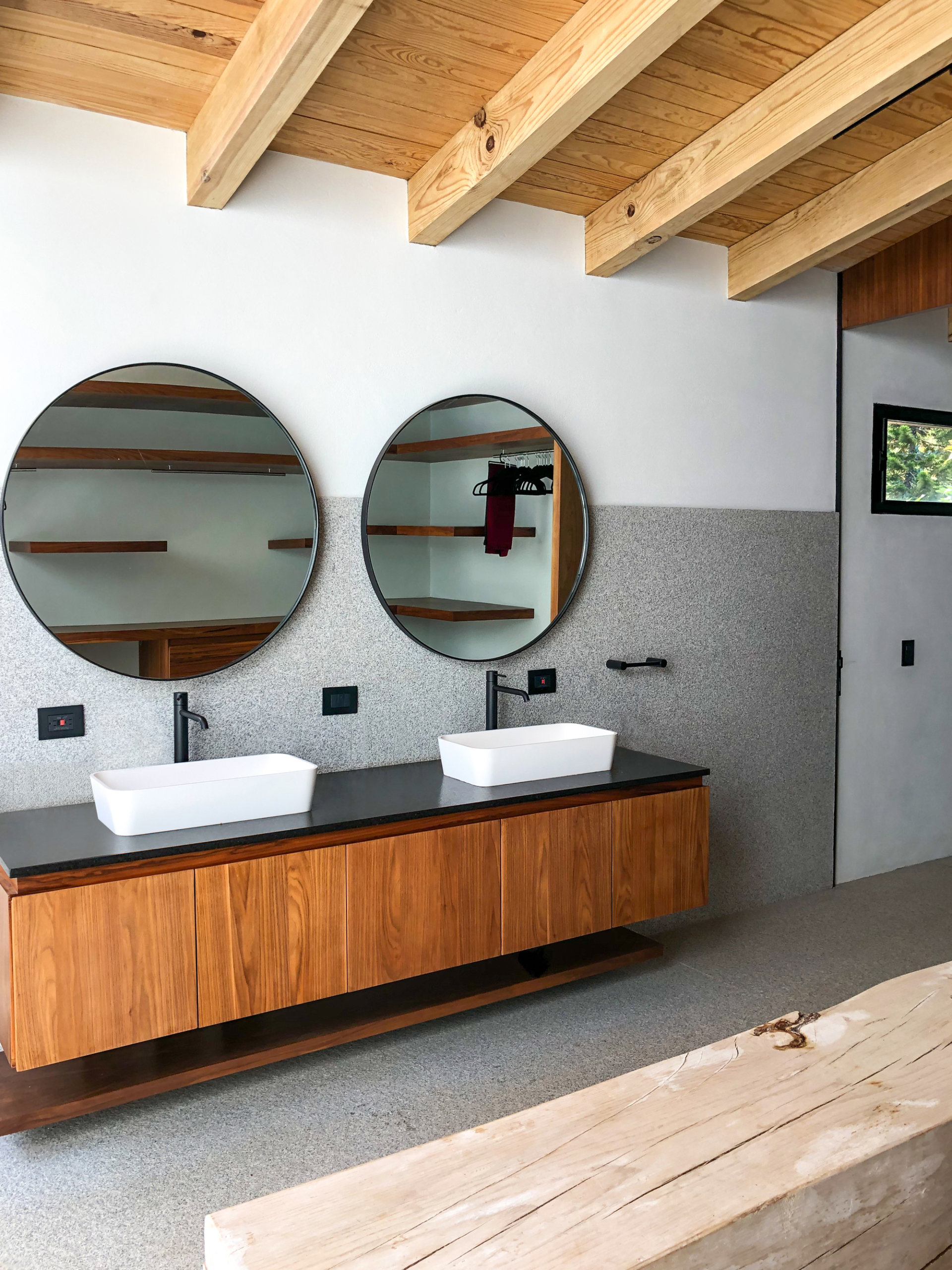 Contemporary bathroom of Eco-friendly Mexican Home with woden ceiling beams and concrete floor